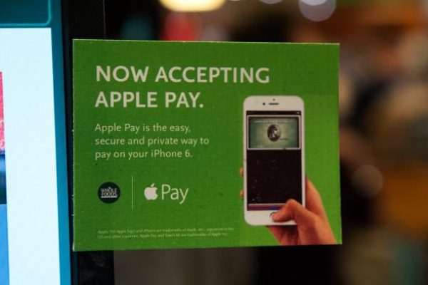 457553182-apple-pay-is-promoted-on-signs-placed-at-the-cash.jpg.CROP.promo-mediumlarge