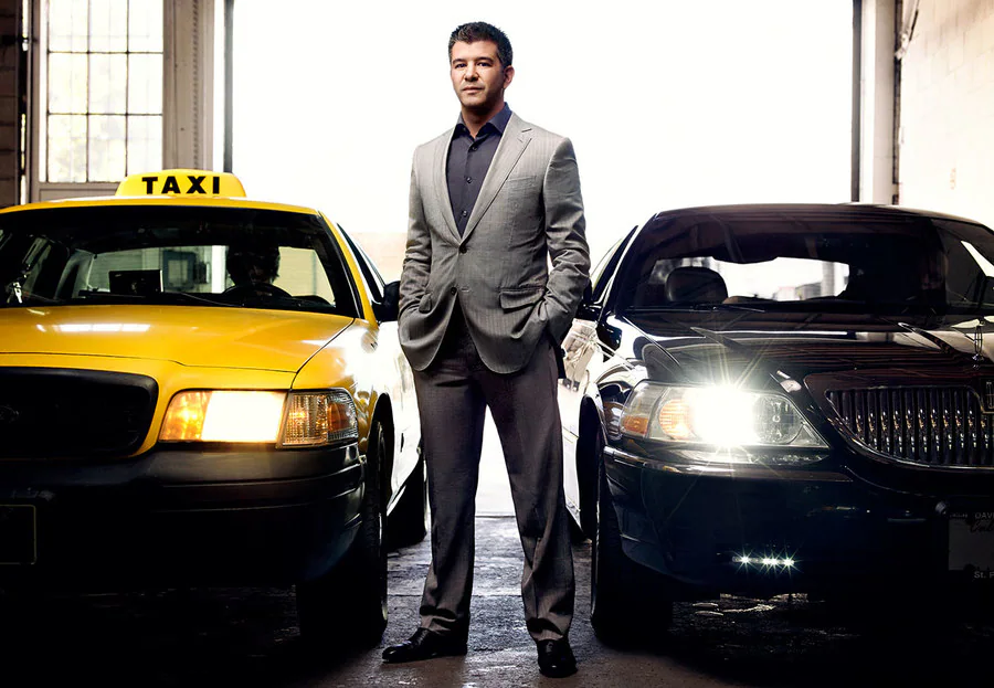 Uber ride-hailing app beside a taxi