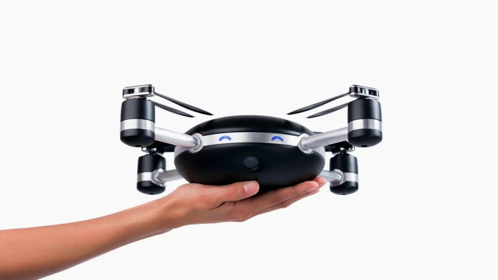 Lily camera drone held in an outstretched hand