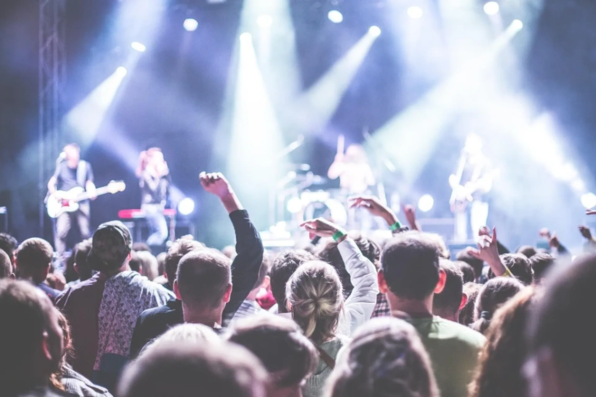 Audience watching a live band perform on stage
