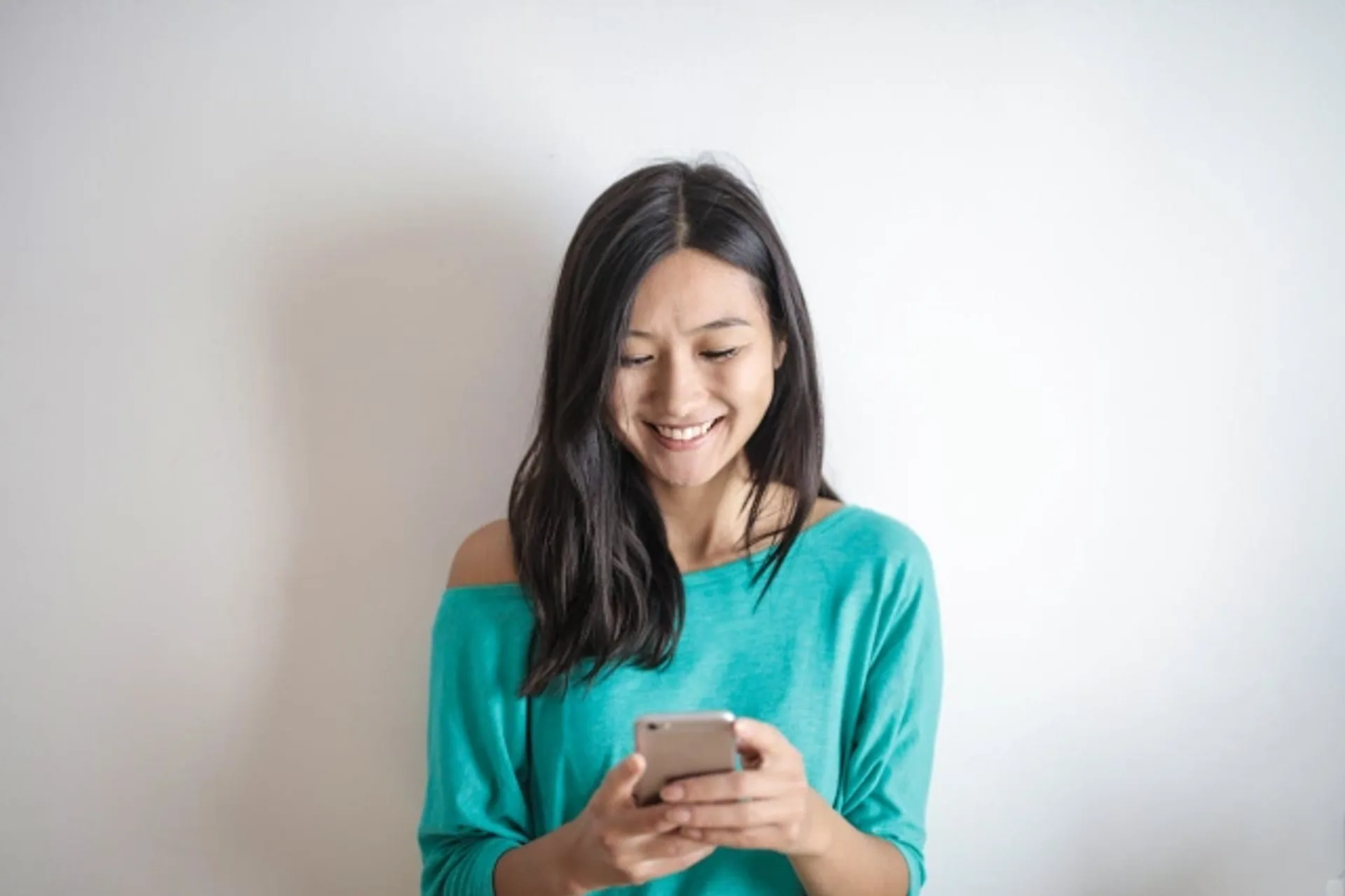 Person using a smartphone to access a mobile wallet pass