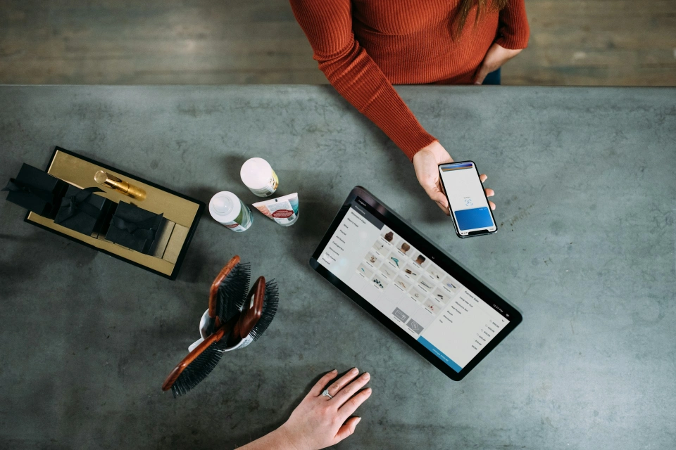 Customer paying with a mobile wallet at a retail checkout
