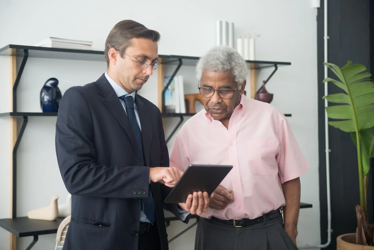 Two professionals reviewing insurance documents together
