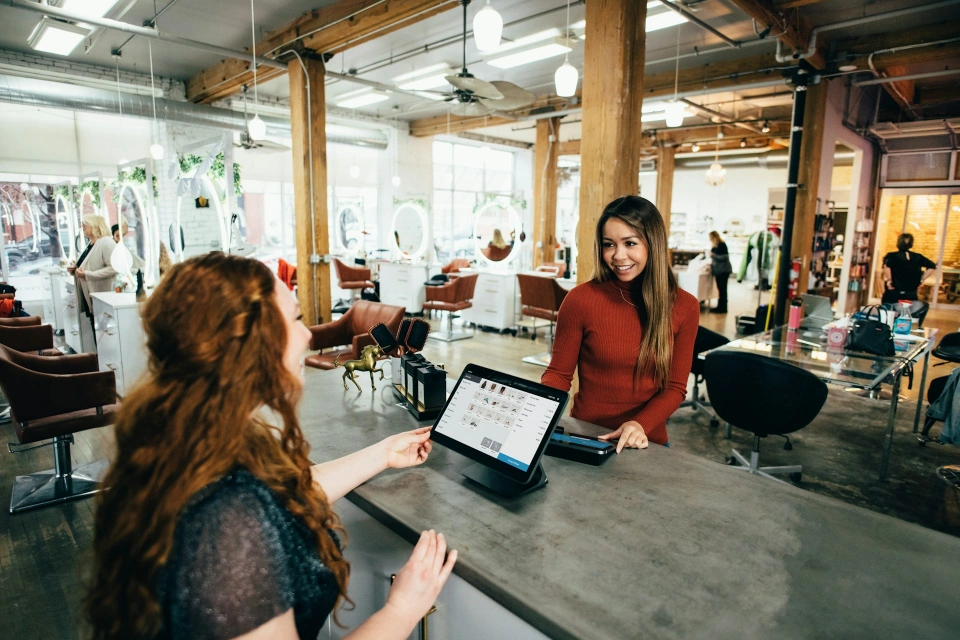 Customer using a tablet at a retail counter