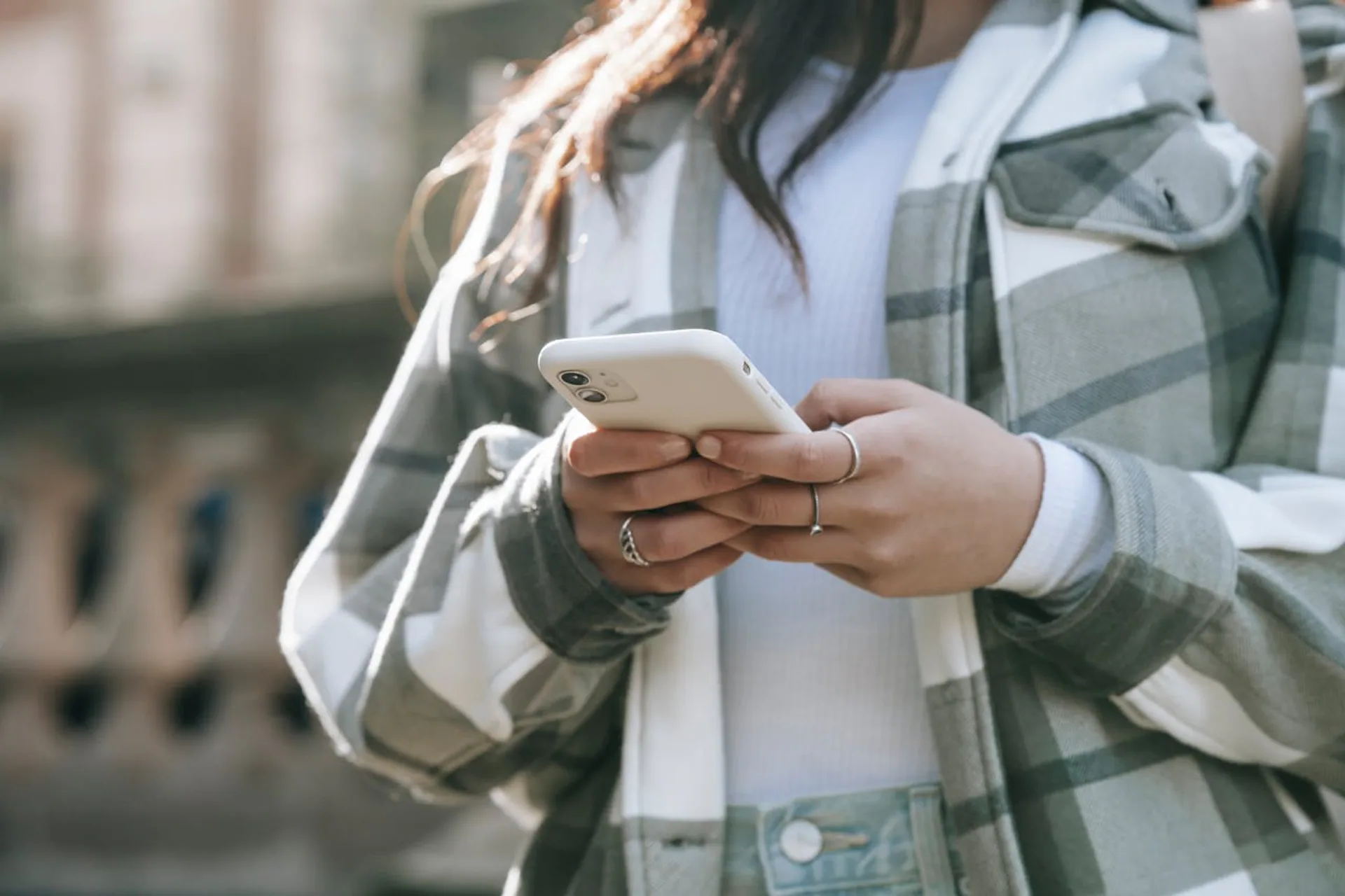Person using a smartphone outdoors