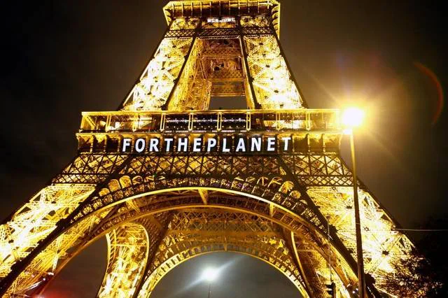 Eiffel Tower illuminated with a For the Planet message