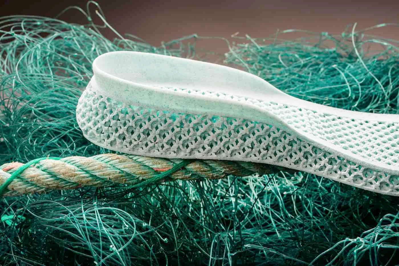 White 3D-printed shoe resting on reclaimed ocean netting