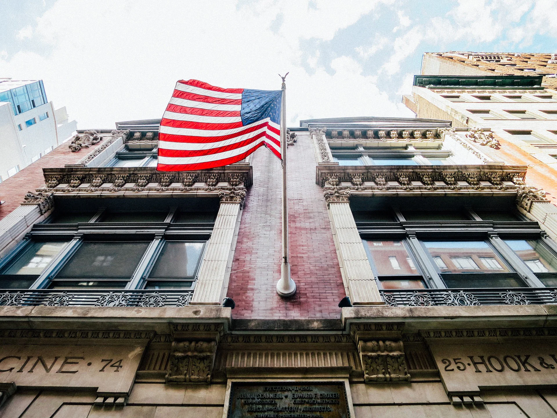 American flag hanging from a building