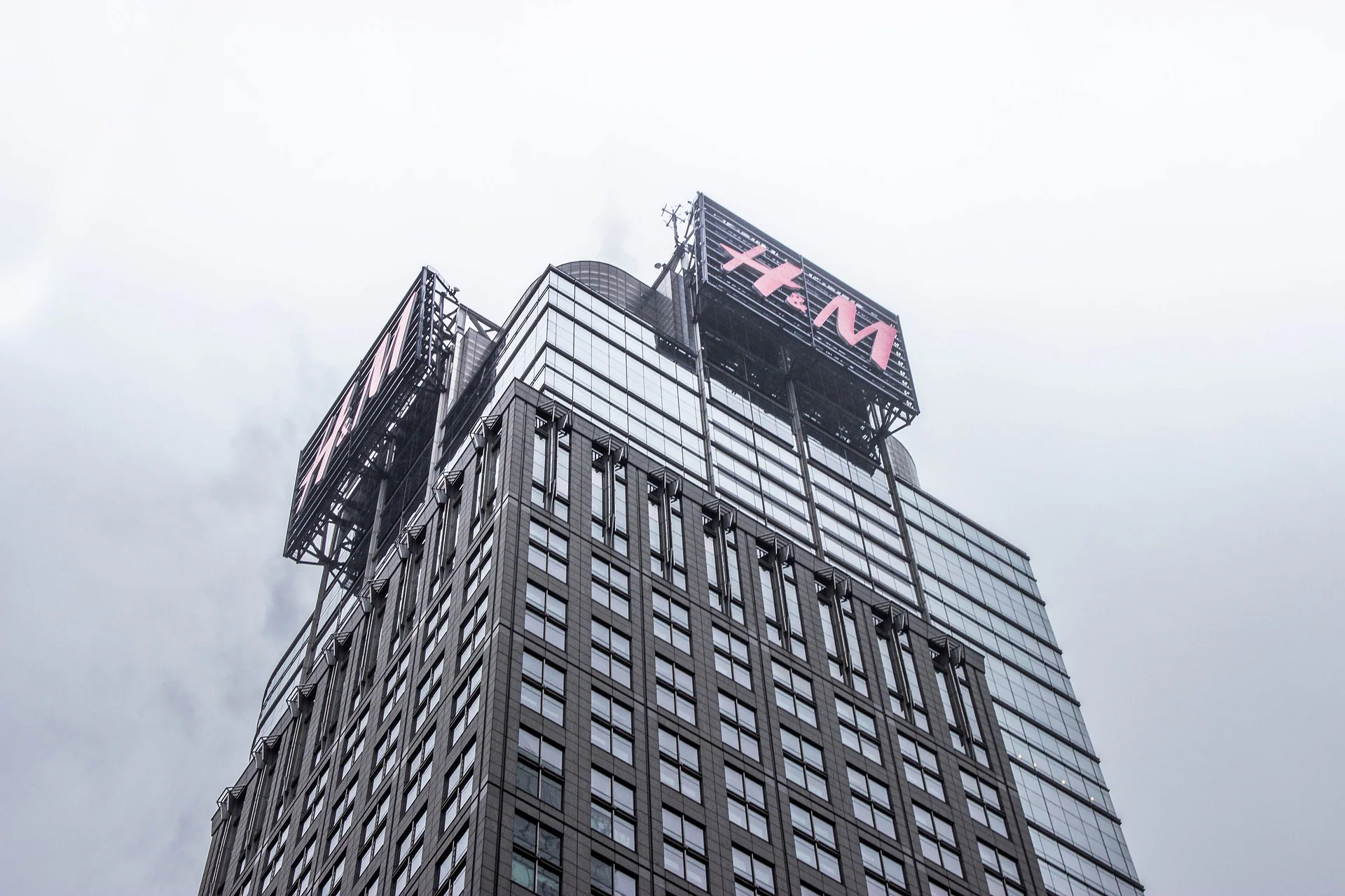 H&M sign at the top of a city building