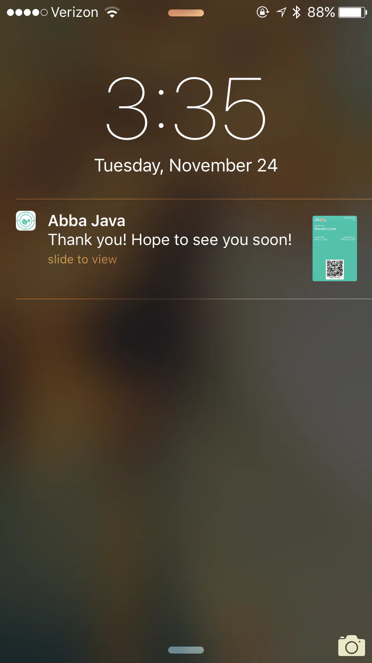 Mobile wallet loyalty notification displayed on a phone lock screen