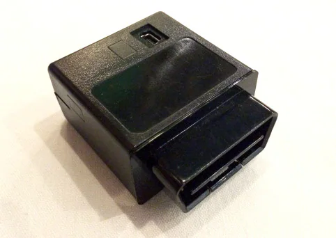 Black connected-car diagnostic device used in a vehicle security test