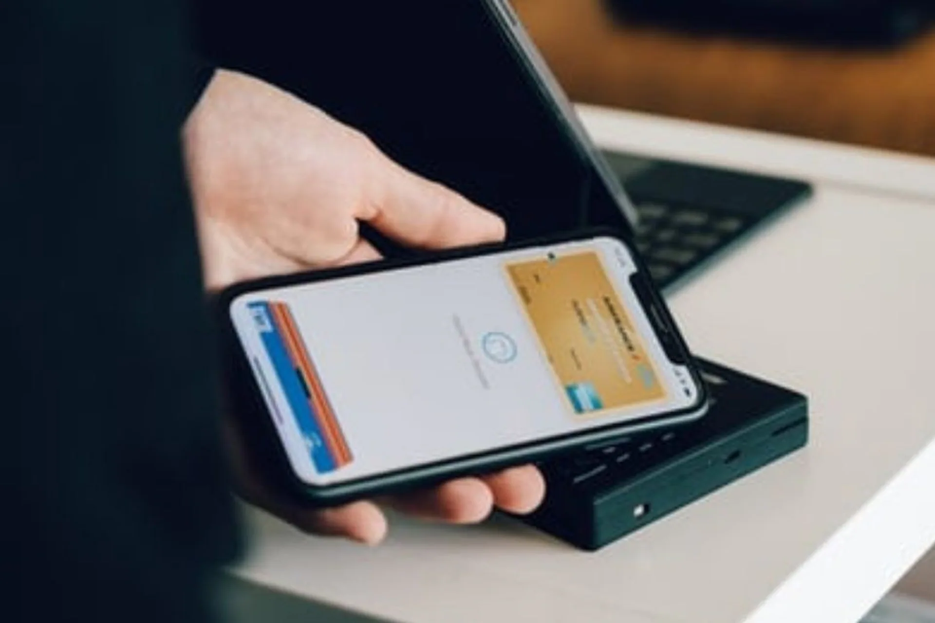 Customer using a smartphone at a payment terminal