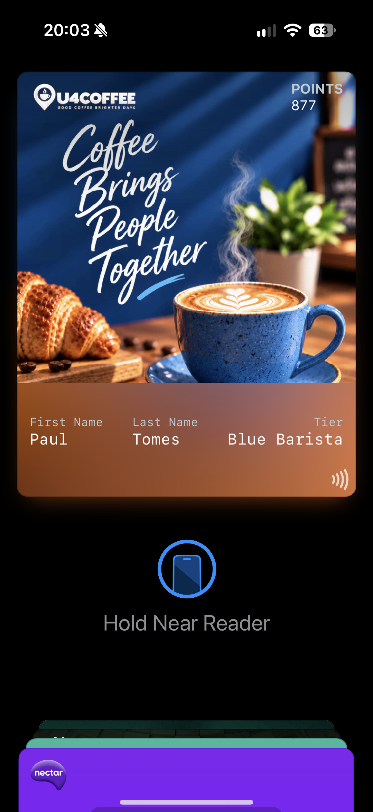An iPhone Wallet view showing the U4Coffee loyalty pass immediately after opening the location-based message.