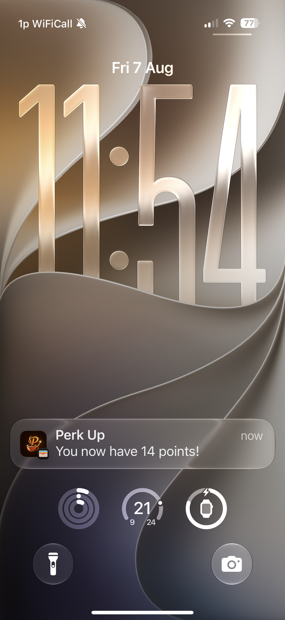 An iPhone lock screen with a Perk Up notification saying the customer now has 14 points.