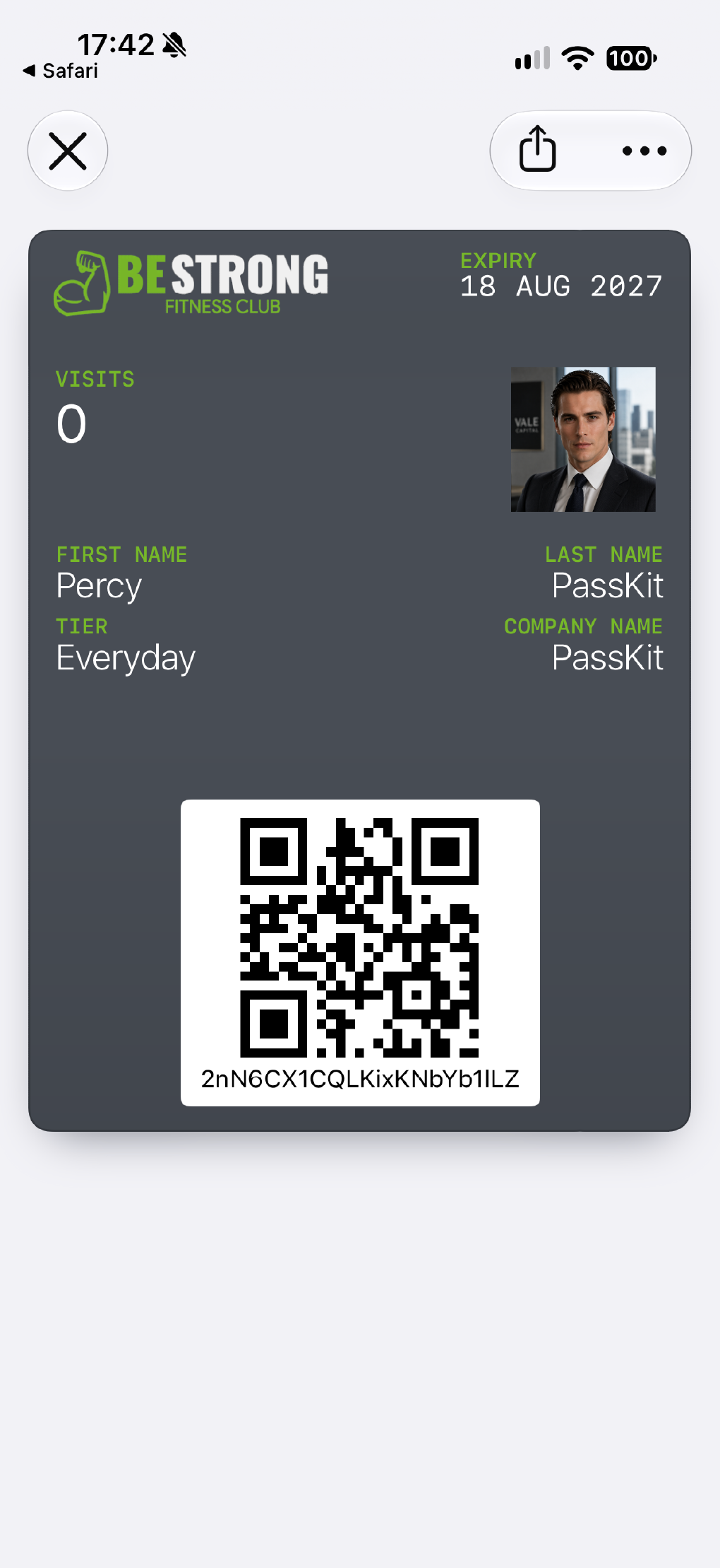 A membership pass shown on an iPhone screen.